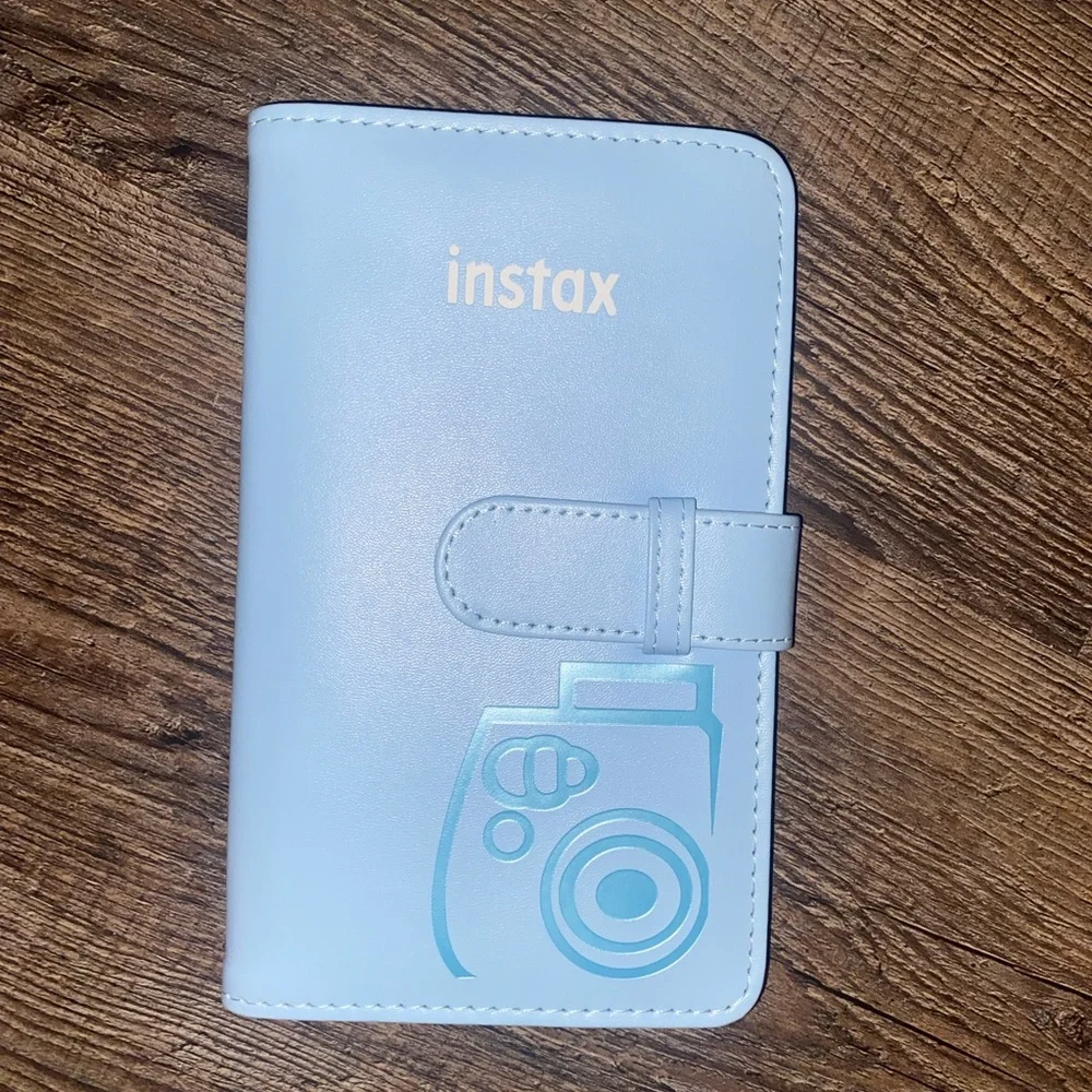 Baby Blue Polaroid Camera with photo book, film, and etc.